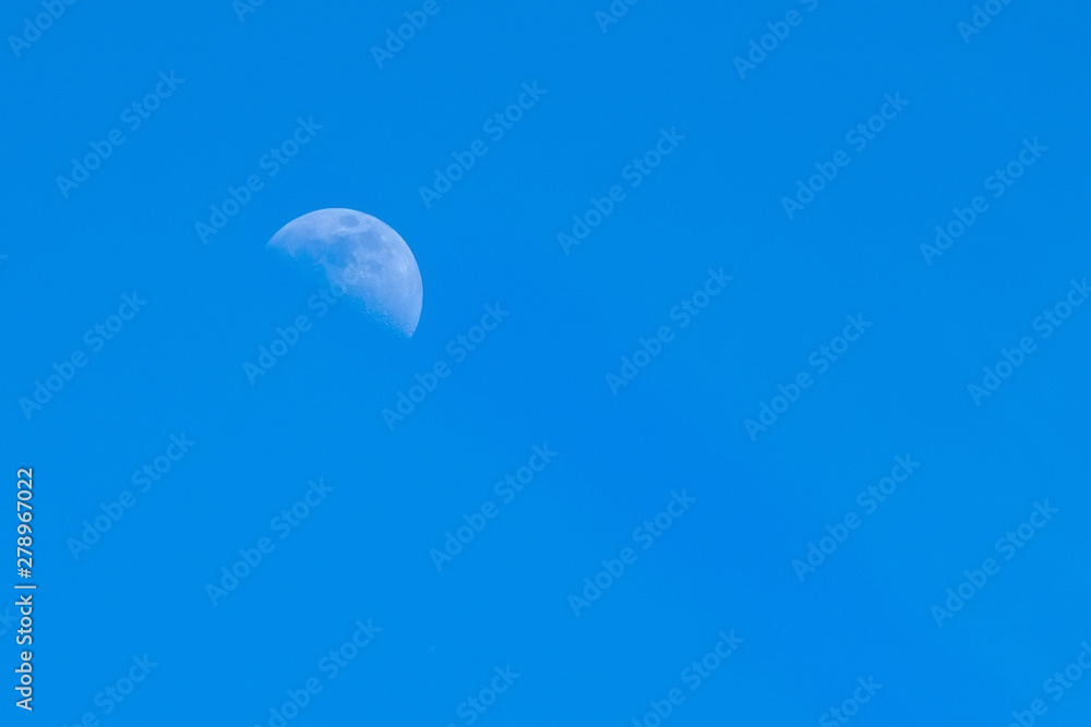 moon on a blue sky day moon on a blue sky day