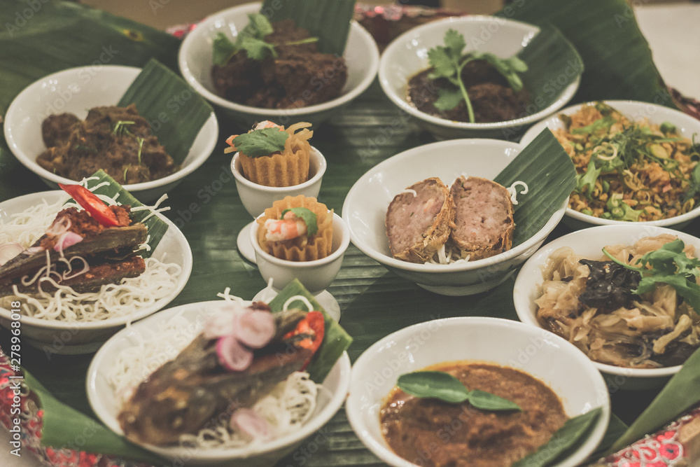 Assorted Peranakan dishes in a peranakan feast in a fine dining restaurant