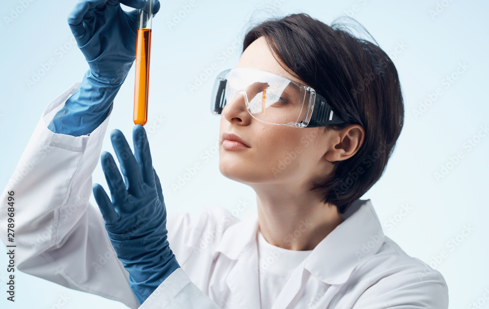 scientist in laboratory with test tubes scientist in laboratory with test tubes