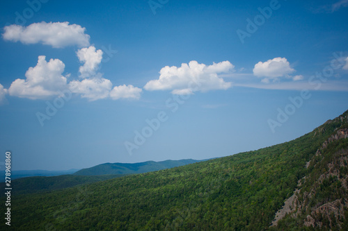 view of the Ural mountains in sunny weather from the mountain