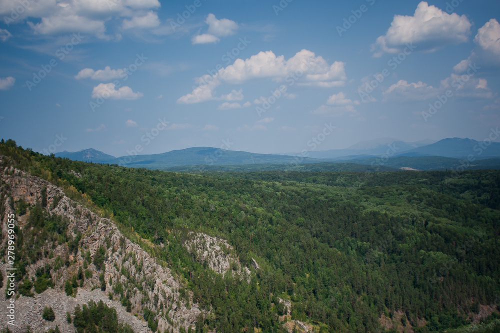 view of the Ural mountains in sunny weather from the mountain