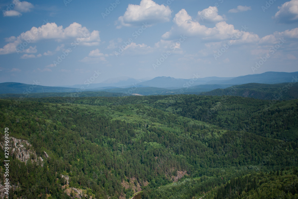 view of the Ural mountains in sunny weather from the mountain