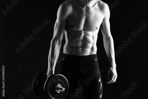 muscular man with dumbbells