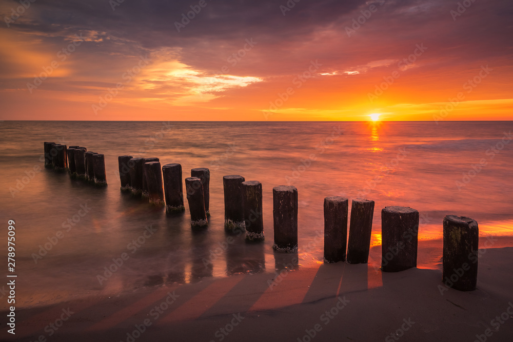 Sunrise over the breakwater on the Baltic sea, Poland