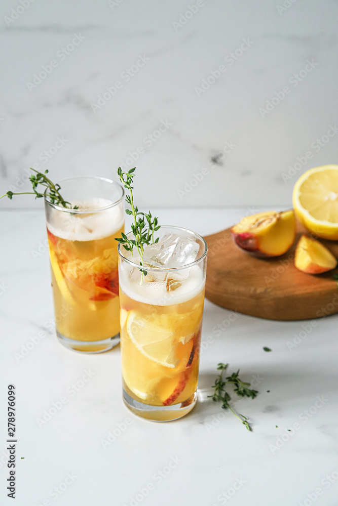 Fresh peach lemonade on light marble background Fresh peach lemonade on light marble background