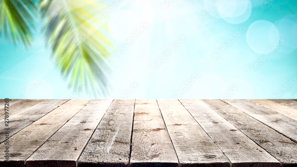 Wooden table background in the beautiful sunny ocean view Wooden table background in the beautiful sunny ocean view
