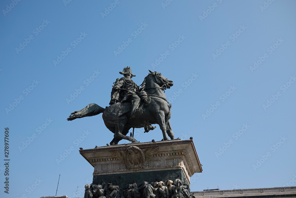Milan, Italy - June 25, 2019 : View of Vittorio Emanuele II statue in piazza Duomo