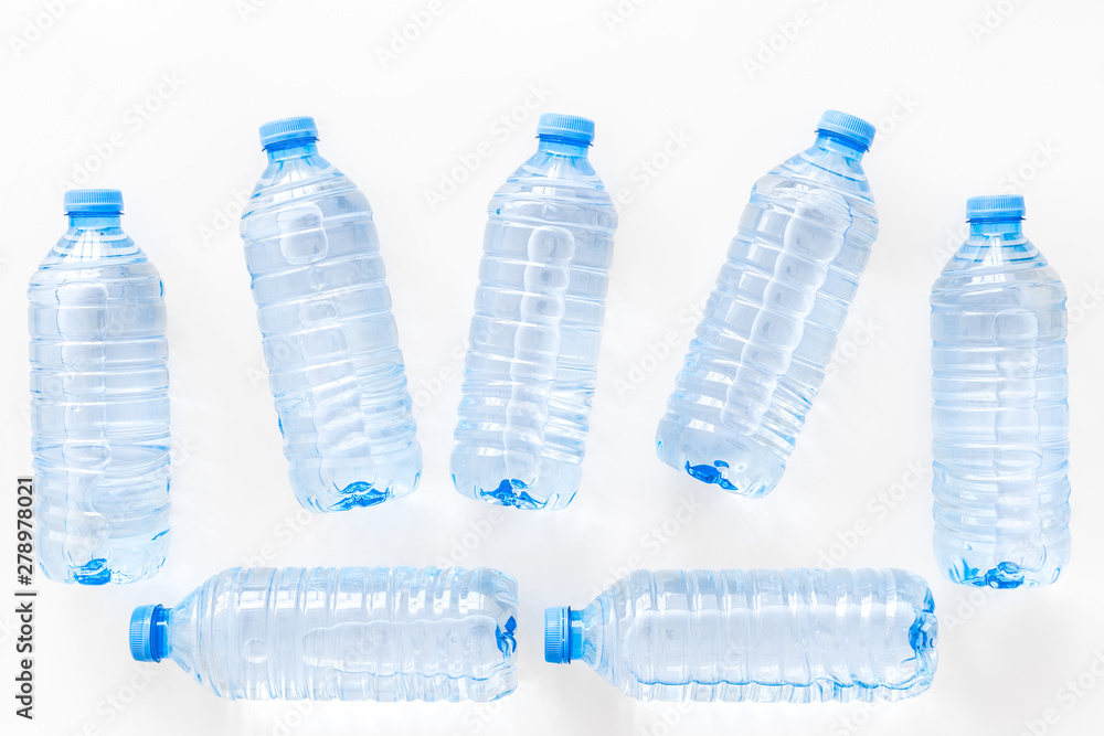 empty plastic bottles for pure water on white background top view pattern empty plastic bottles for pure water on white background top view pattern