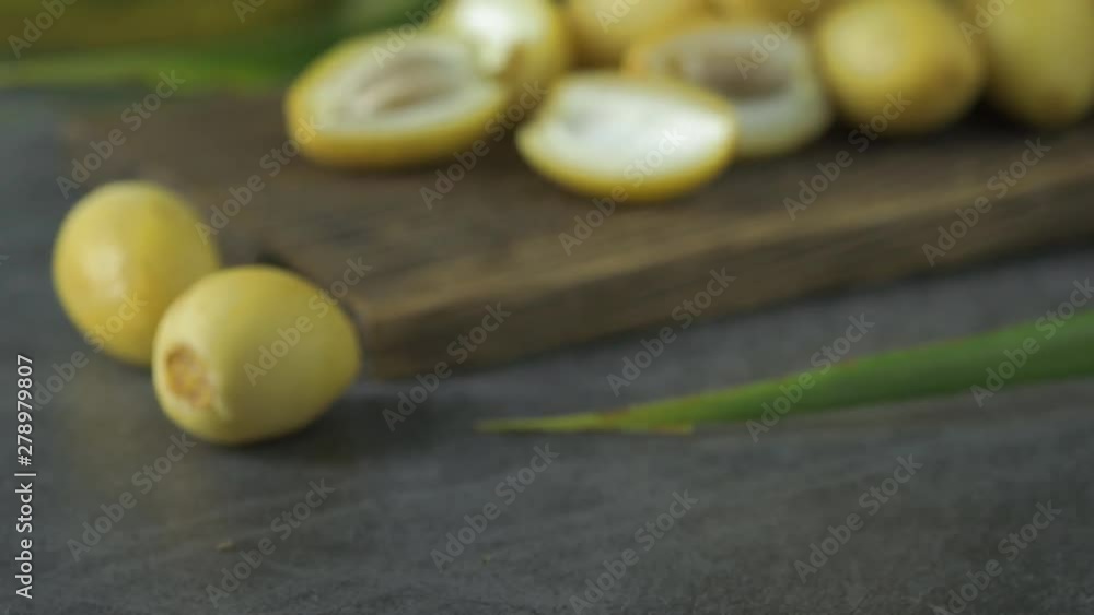 The date-palm fresh they are placed on the table with oil, health food concept., Date Palm. Raw Date Palm(Phoenix dactylifera) fruits The date-palm fresh they are placed on the table with oil, health food concept., Date Palm. Raw Date Palm(Phoenix dactylifera) fruits