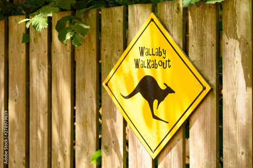 Wallaby walkabout sign on a wooden fence