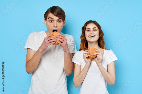 two girls eating pizza