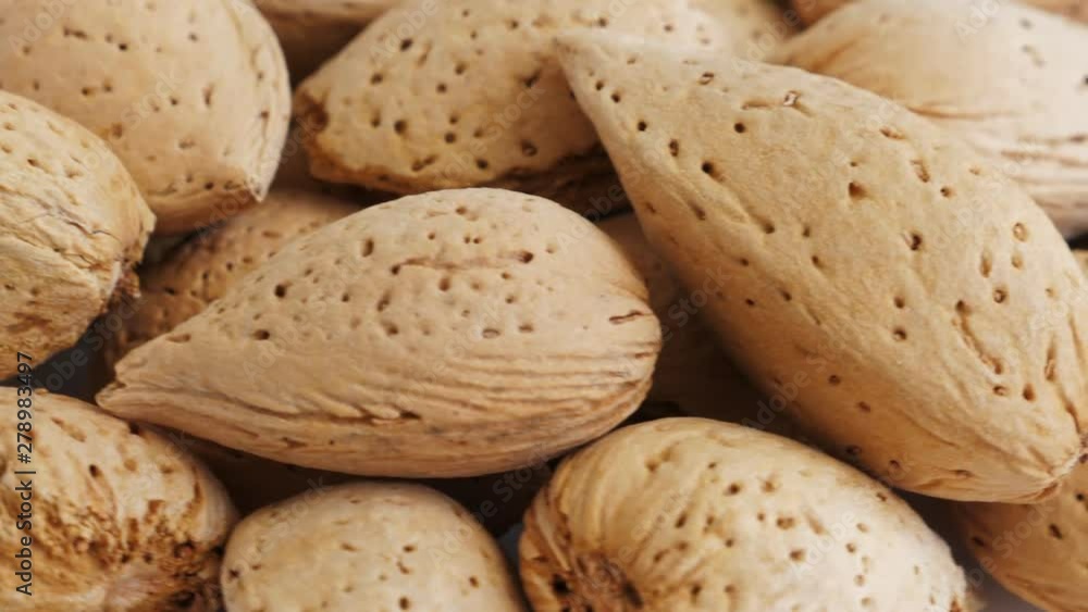Almonds abstract background, top view. Rotate Almonds abstract background, top view. Rotate