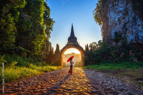Quadro su tela Woman standing at Khao Na Nai Luang Dharma Park in Surat Thani, Thailand
