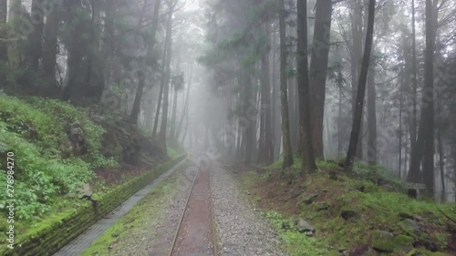 Old Abandoned Railroad in Alishan Scenic Area Forest with Mist, Haze and Fog in Taiwan. Aerial View photo