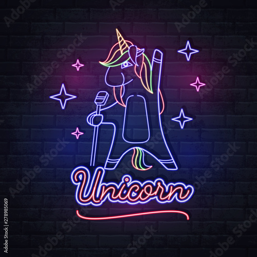 Neon sign singing unicorn on brick background. Vintage electric signboard.