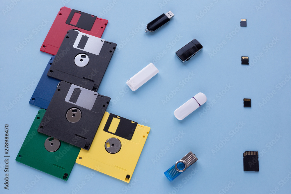 The evolution of digital data storage device. Floppy disks, flash drives and small memory cards. The evolution of digital data storage device. Floppy disks, flash drives and small memory cards.