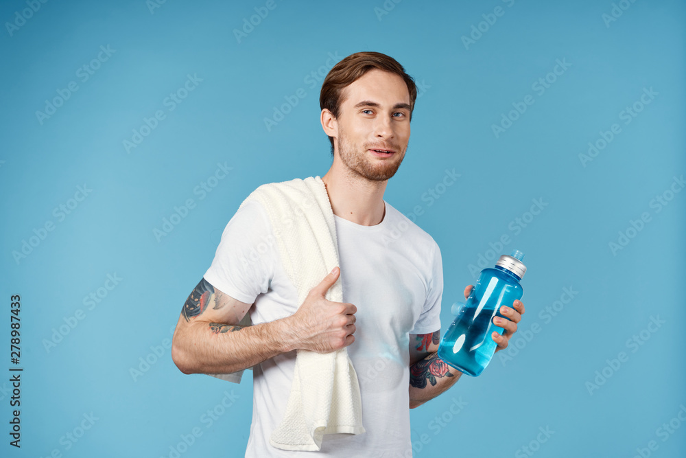 young man with bottle of water young man with bottle of water