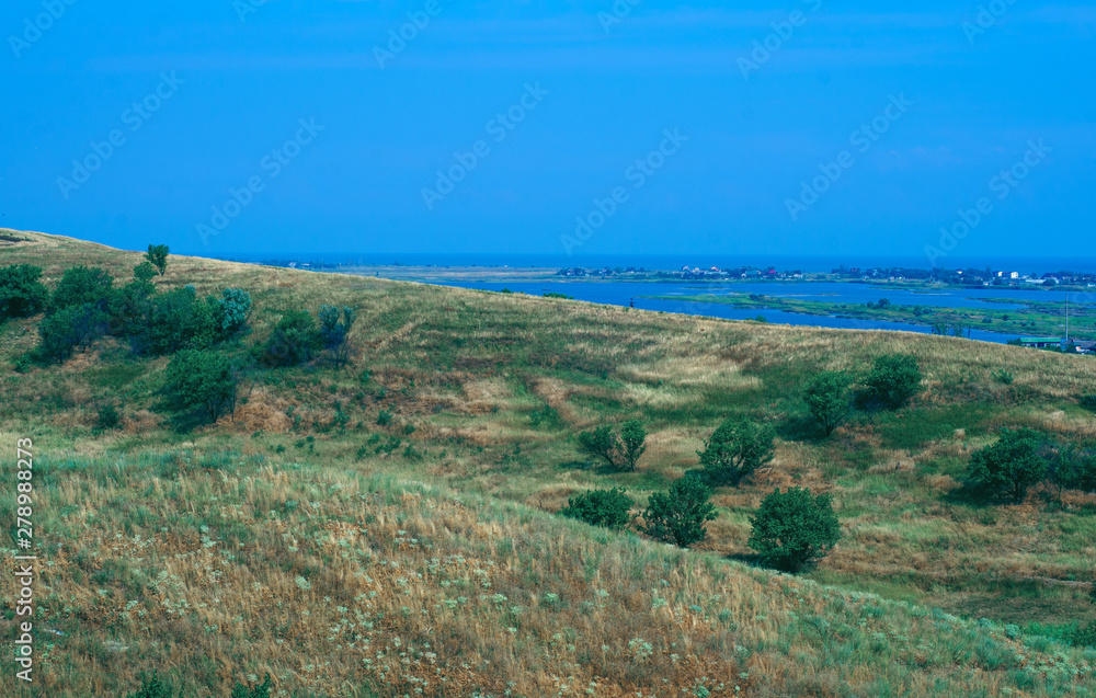 Fototapeta premium field hills view of the sea nature background