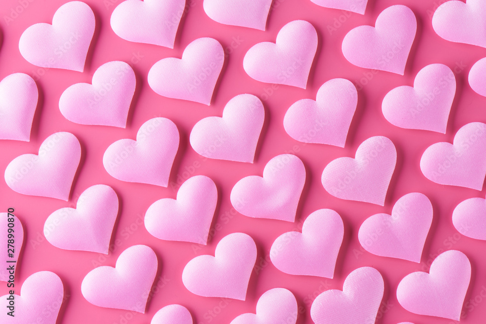 Many volumetric hearts on a pink background for Valentine's Day with love