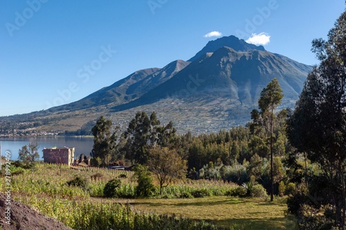 Beautiful view of the Imbabura volcano, the San Pablo lake and green fields, on a beautiful day. Ecuador, South America © alanfalcony