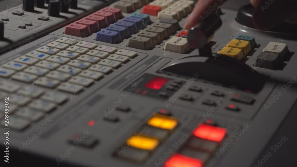 Broadcast Tv Studio Production - Vision Switcher Studio Director broadcast video mixer operation - Close-up of hand Broadcast Tv Studio Production - Vision Switcher Studio Director broadcast video mixer operation - Close-up of hand