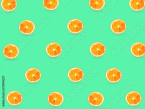 Fruit pattern of fresh orange slices on green background  Summer feeling fresh.