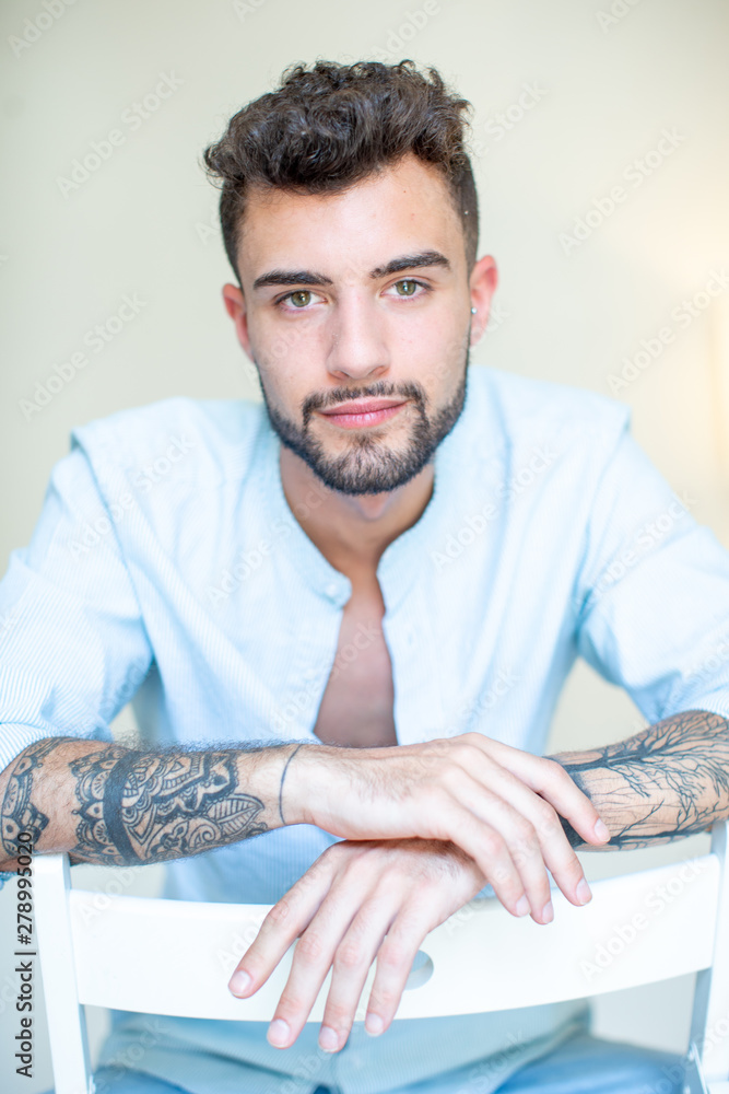 Fototapeta premium young tattoo man in a chair