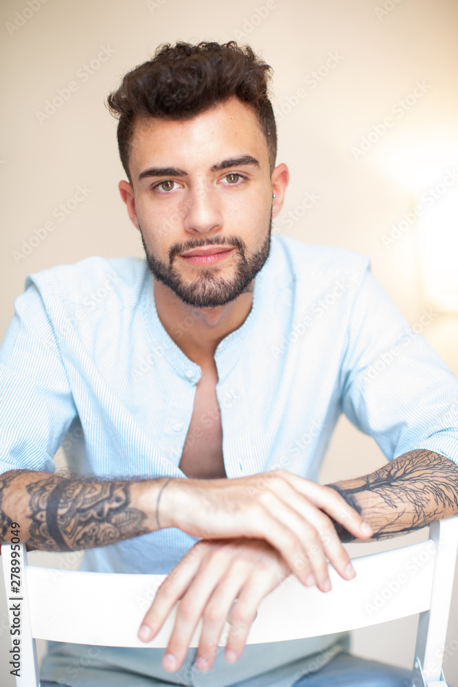 Fototapeta premium young tattoo man in a chair