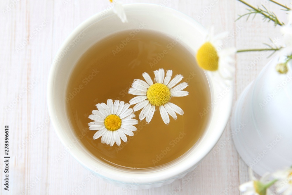 cup of tea with chamomile flowers cup of tea with chamomile flowers