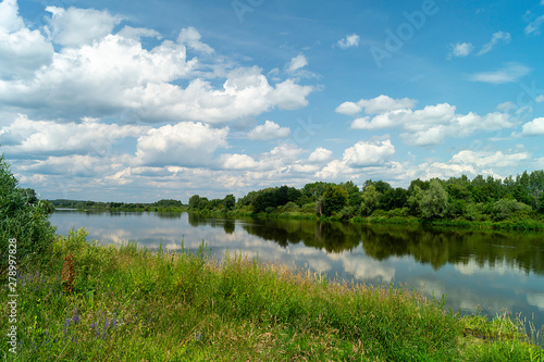 River in rural terrain at spring length of time