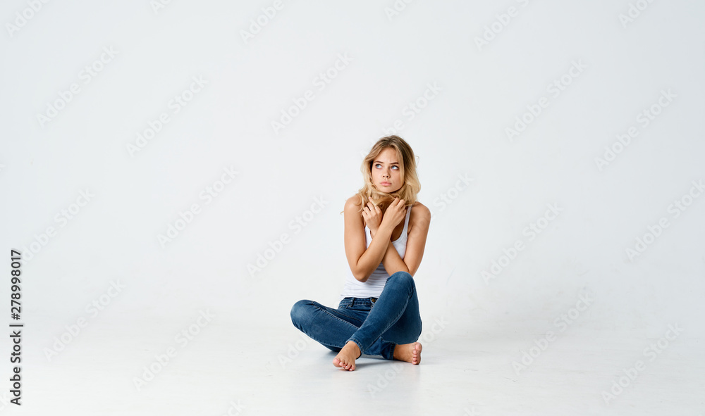 young woman sitting on the floor young woman sitting on the floor