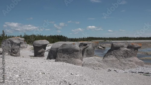 ROCK MONOLITES. Tourists from all over the world come to the Mingan archipelago to see the ROCK MONOLITES on the Canadian coast in the province of Quebec. photo