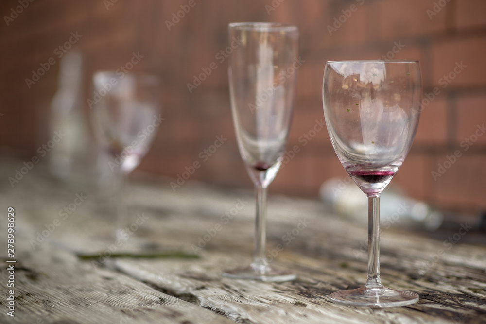 glasses of wine on an old wooden table