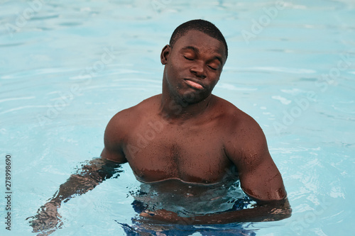 young man in swimming pool © SHOTPRIME STUDIO