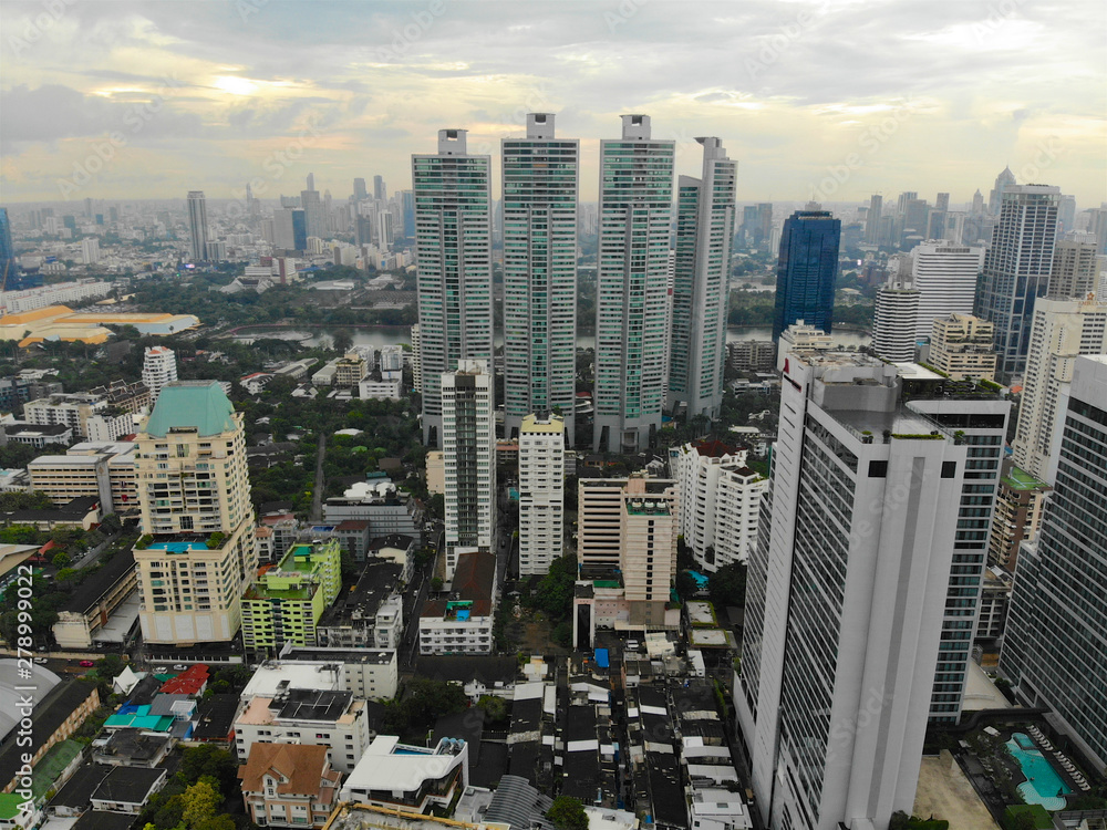 Fototapeta premium Bangkok Metropolis, aerial view over the biggest city in Thailand. Bangkok skyline from Sukhumvit street. Aerial view of Bangkok skyline and skyscraper. Thailand