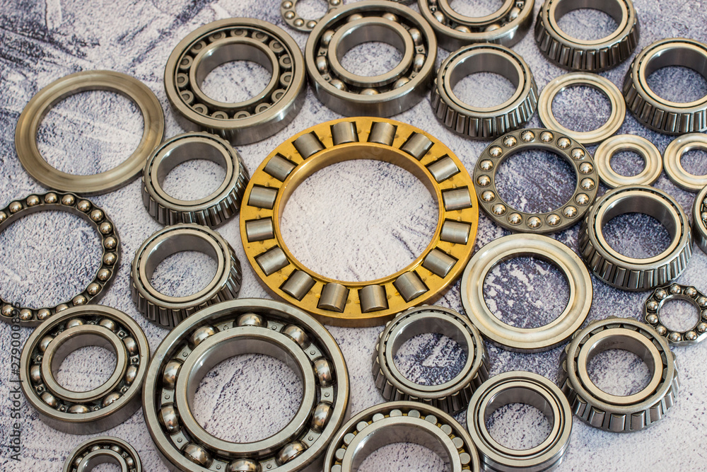 Different bearings on a concrete background.