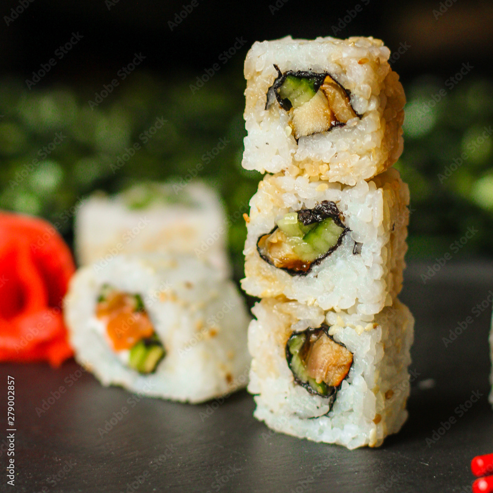 Sushi maki rolls (tuna, salmon, shrimp, avocado and other ingredients). japanese food. Top view, assorted sushi, you can eat menu. copy space Sushi maki rolls (tuna, salmon, shrimp, avocado and other ingredients). japanese food. Top view, assorted sushi, you can eat menu. copy space