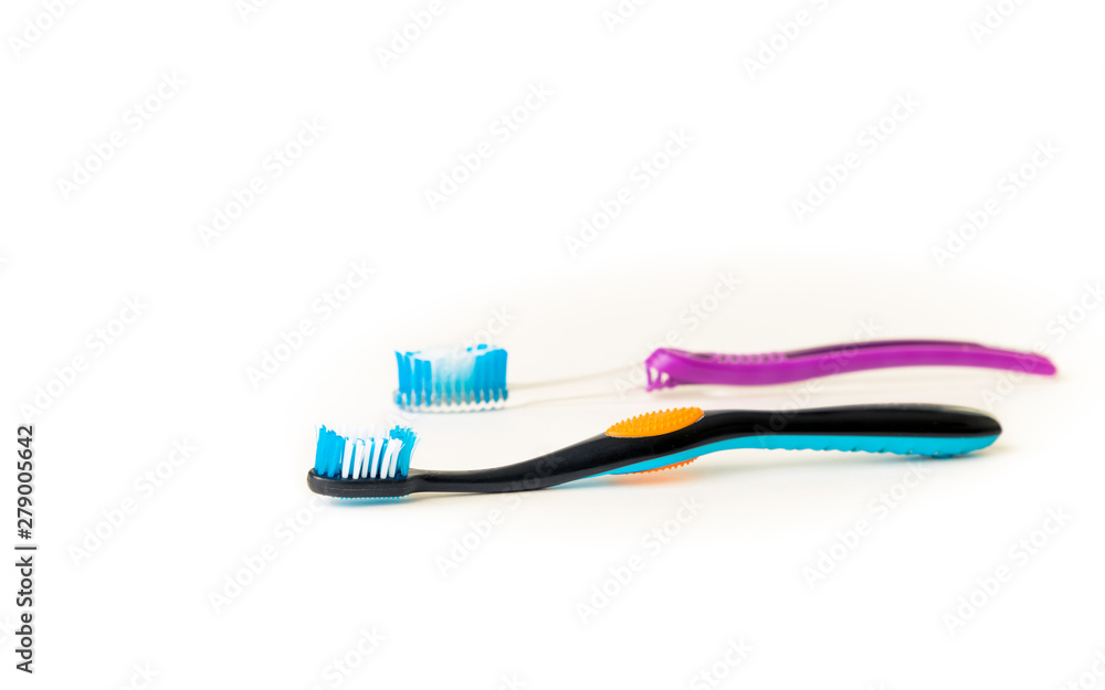 His and her toothbrush on a white background. His and her toothbrush on a white background.