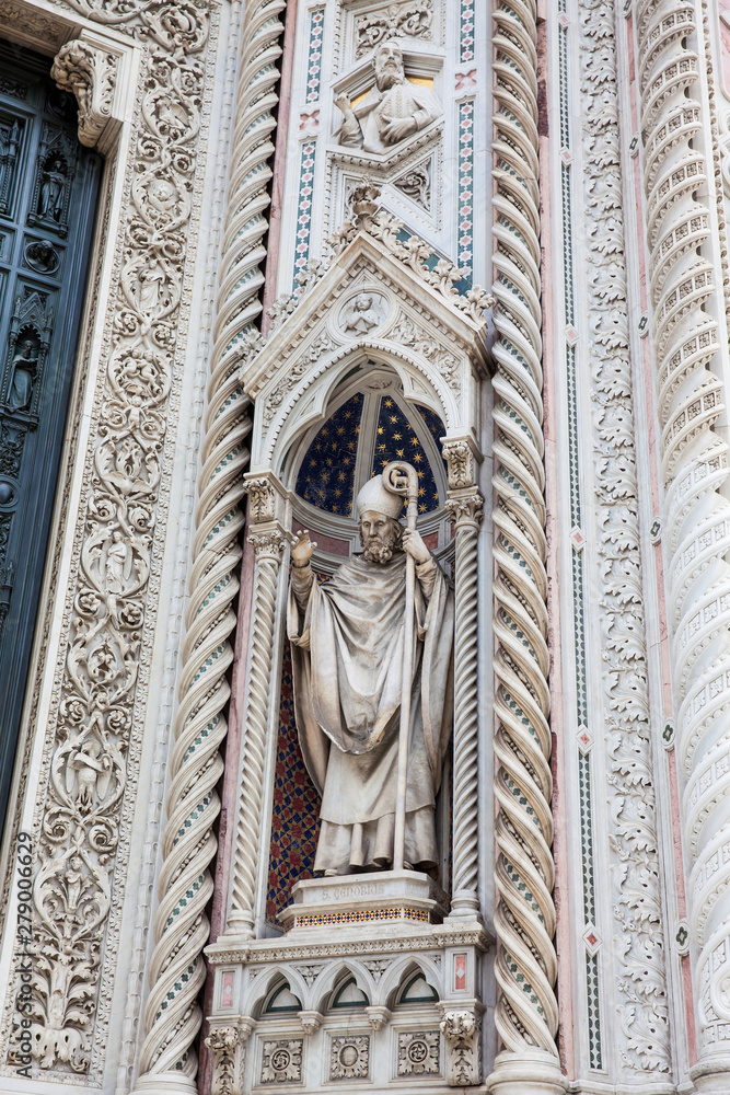 Statue on the facade of the beautiful Florence Cathedral formally called Cattedrale di Santa Maria del Fiore consecrated in 1436