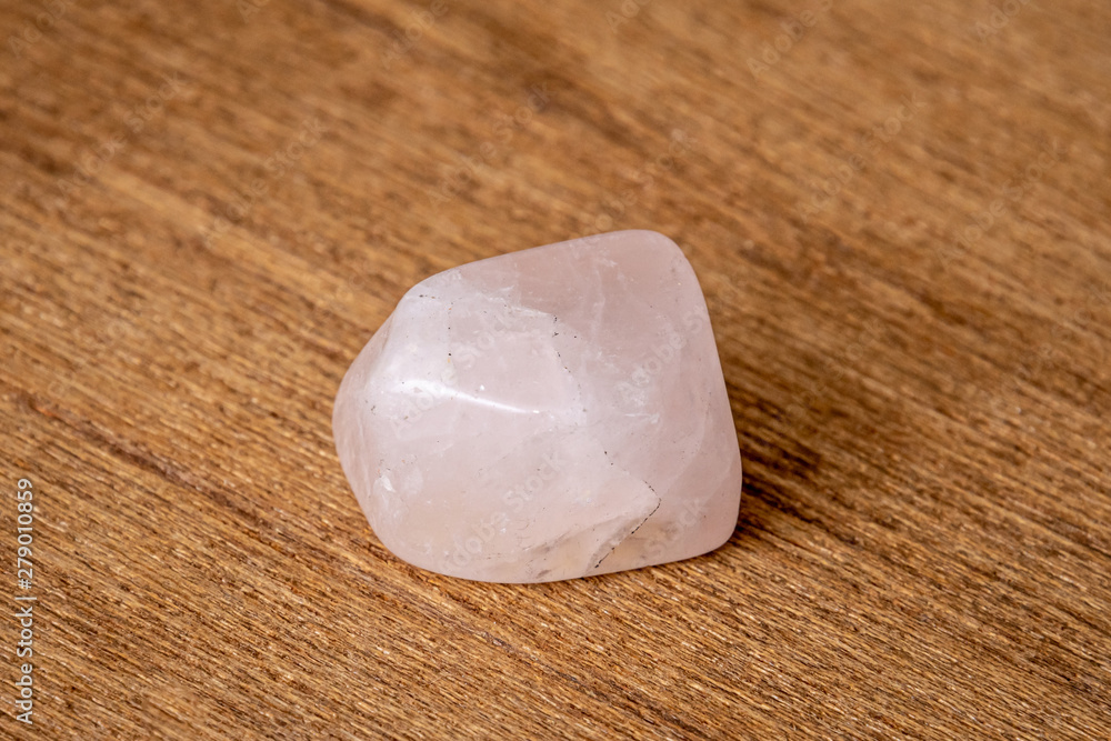 Rosa rose pink gemstone gem jewel mineral precious shiny on wooden underground Rosa rose pink gemstone gem jewel mineral precious shiny on wooden underground