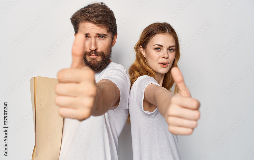 young couple with thumbs up young couple with thumbs up