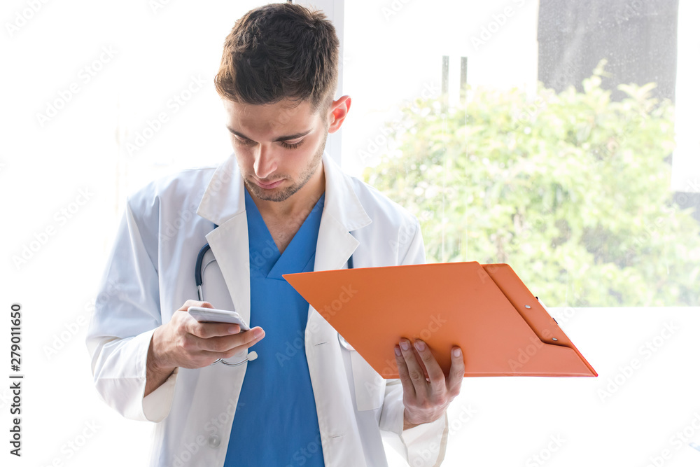 doctor at the clinic with a mobile phone and documents doctor at the clinic with a mobile phone and documents