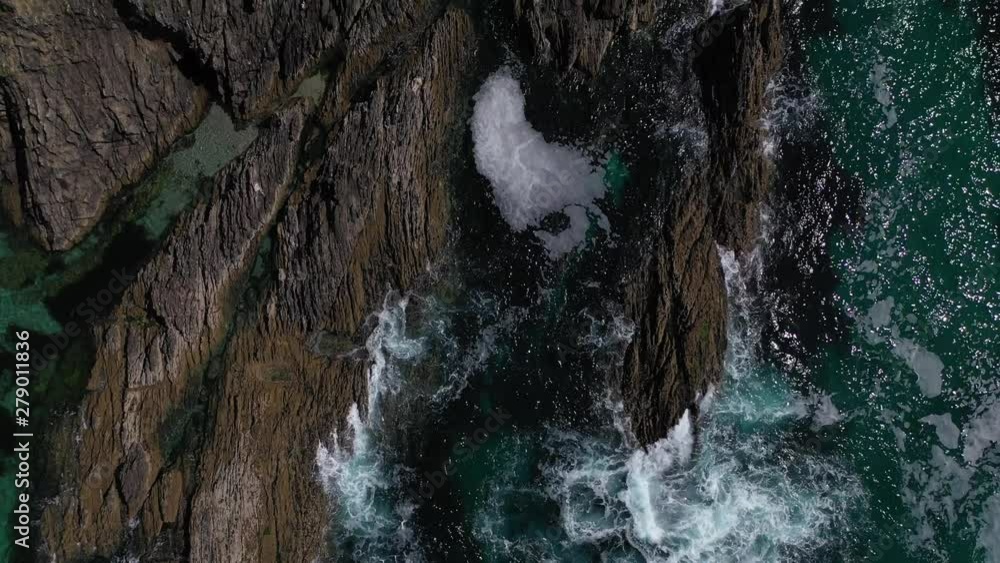 sea waves crashing against a rocky shore top view from the drone sea waves crashing against a rocky shore top view from the drone