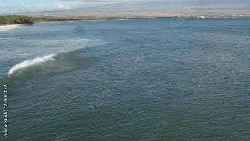Surfer paddling out on the Ocean