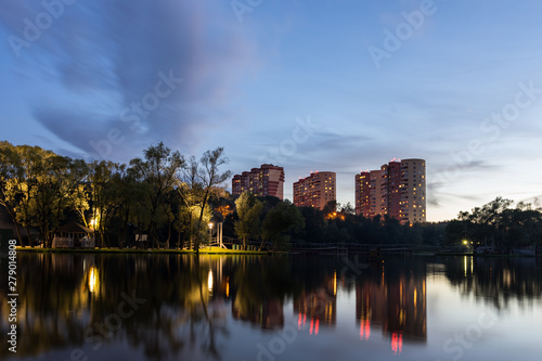View from Zarechie park and riverbank on Nagornaya Street buildings in Troitsk city in the evening - Region of New Moscow © evgenydrablenkov