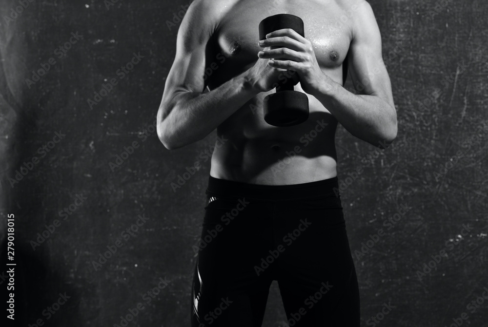 Naklejka premium young man lifting weights