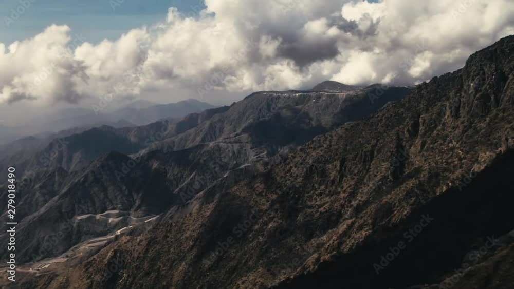 TIMELAPSE of clouds rolling over mountains in Asir Province, LOCKED OFF TIMELAPSE of clouds rolling over mountains in Asir Province, LOCKED OFF