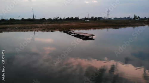 Old wooden pier on the lake. photo