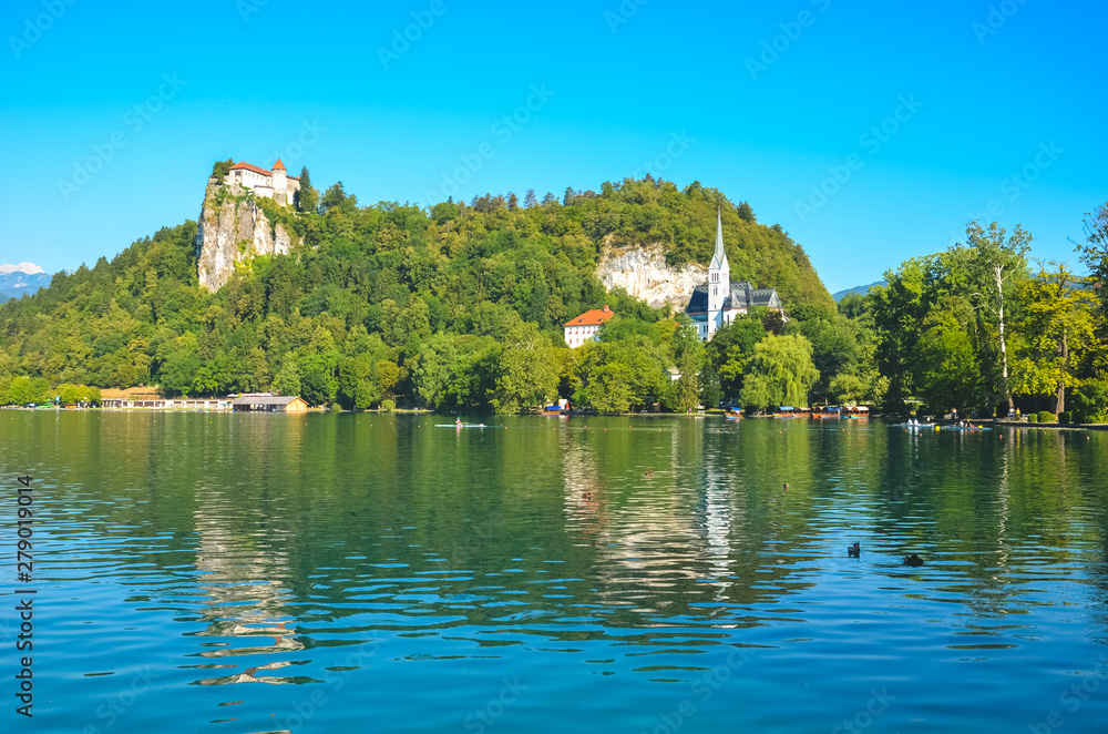 Historical Bled Castle surrounded by beautiful lake in Bled, Slovenia. Bled Lake is a popular travel destination and popular holiday spot. History, ancient, Europe Historical Bled Castle surrounded by beautiful lake in Bled, Slovenia. Bled Lake is a popular travel destination and popular holiday spot. History, ancient, Europe