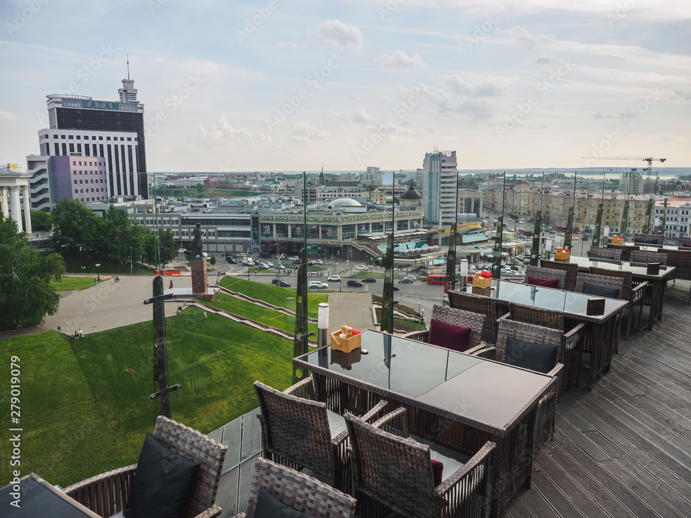 Sky cafe on the roof terrace with view of modern city Sky cafe on the roof terrace with view of modern city
